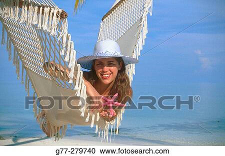 Woman on a hammock. White Sands Resort and Spa. Ari Atoll, Maldives View Large Photo Image Stock Image - Woman on a hammock. White Sands Resort and Spa. Ari Atoll, Maldives. Fotosearch