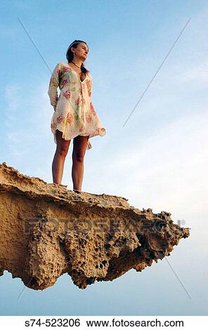 Woman on a sandstone rock formation. Formentera. Balearic Islands. Spain. View Large Photo Image Stock Photograph - Woman on a sandstone rock formation. Formentera. Balearic Islands. Spain.. Fotosearch