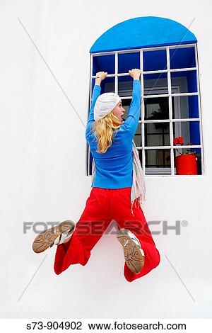 Woman on a window of Mykonos Island, Cyclades, Greece View Large Photo Image Stock Image - Woman on a window of Mykonos Island, Cyclades, Greece. Fotosearch
