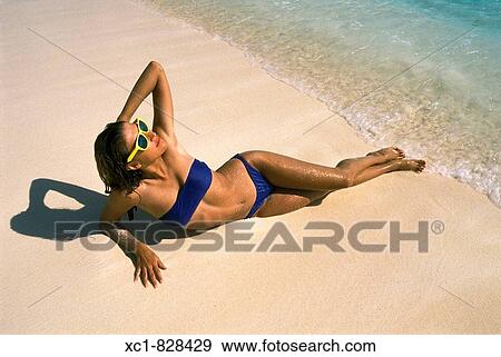 Stock Photo - Woman on Beach, Caribbean Sea, Cancun, Mexico. Fotosearch