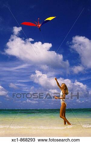 Woman on beach flying a kite, Punta Cana, Dominican Republic, Caribbean View Large Photo Image Stock Image - Woman on beach flying a kite, Punta Cana, Dominican Republic, Caribbean. Fotosearch