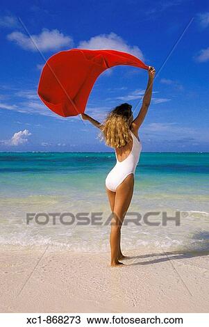 Woman on beach holding a towel, Punta Cana, Dominican Republic, Caribbean View Large Photo Image Stock Image - Woman on beach holding a towel, Punta Cana, Dominican Republic, Caribbean. Fotosearch