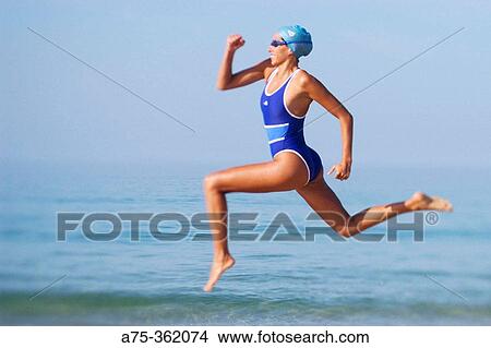 Picture - Woman on beach. Fotosearch