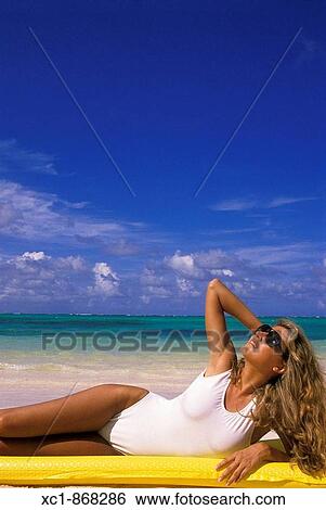 Stock Photograph - Woman on beach, Punta Cana, Dominican Republic, Caribbean. Fotosearch
