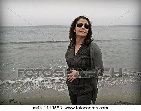 Woman on beach View Large Photo Image Stock Image - Woman on beach. Fotosearch