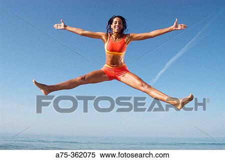 Stock Photography - Woman on beach. Fotosearch