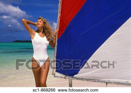 Woman on beach with sailboat, Punta Cana, Dominican Republic, Caribbean View Large Photo Image Stock Photograph - Woman on beach with sailboat, Punta Cana, Dominican Republic, Caribbean. Fotosearch