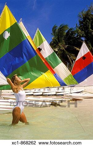 Woman on beach with sailboats, Punta Cana, Dominican Republic, Caribbean View Large Photo Image Stock Image - Woman on beach with sailboats, Punta Cana, Dominican Republic, Caribbean. Fotosearch