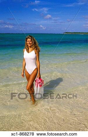 Woman on beach with snorkeling gear, Punta Cana, Dominican Republic, Caribbean View Large Photo Image Stock Photo - Woman on beach with snorkeling gear, Punta Cana, Dominican Republic, Caribbean. Fotosearch