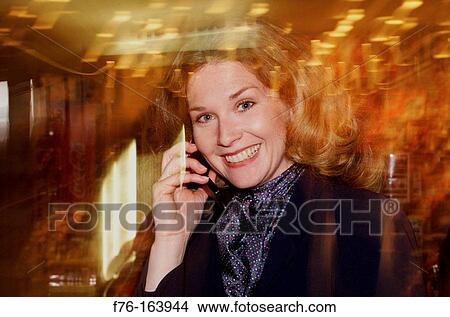 Woman on cell phone View Large Photo Image Picture - Woman on cell phone. Fotosearch