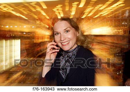 Stock Image - Woman on cell phone. Fotosearch