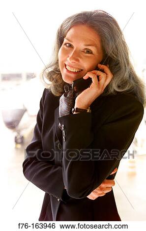 Woman on cell phone View Large Photo Image Stock Photograph - Woman on cell phone. Fotosearch