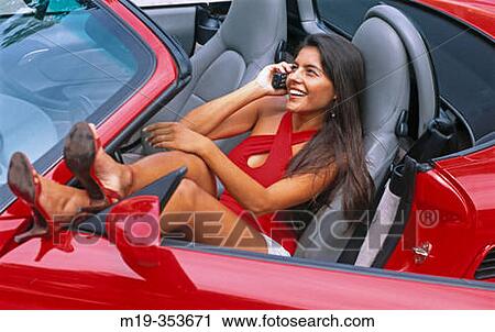 woman on cellular in her convertible View Large Photo Image Stock Image - woman on cellular in her convertible. Fotosearch