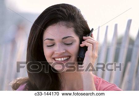 Woman on cellular phone View Large Photo Image Stock Image - Woman on cellular phone. Fotosearch