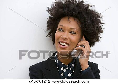 Stock Image - Woman on cellular phone. Fotosearch
