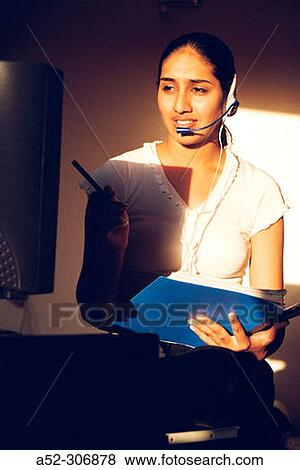 Woman on computer with headphones View Large Photo Image Stock Photo - Woman on computer with headphones. Fotosearch