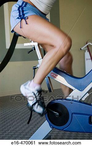 woman on exercise bike View Large Photo Image Stock Image - woman on exercise bike. Fotosearch
