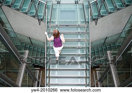 Woman on glass extension staircase, Manchester Art Gallery, Manchester, UK. View Large Photo Image Stock Photograph - Woman on glass extension staircase, Manchester Art Gallery, Manchester, UK.. Fotosearch