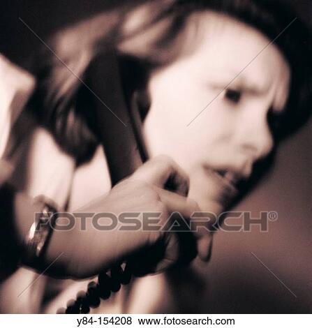 Stock Photo - Woman on phone. Fotosearch