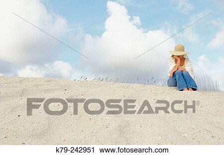 Stock Image - woman on sand dune. Fotosearch