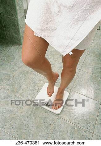 Woman on scale View Large Photo Image Stock Image - Woman on scale. Fotosearch