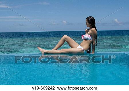 Woman on swimmingpool, Maldives, Indian Ocean View Large Photo Image Stock Image - Woman on swimmingpool, Maldives, Indian Ocean. Fotosearch