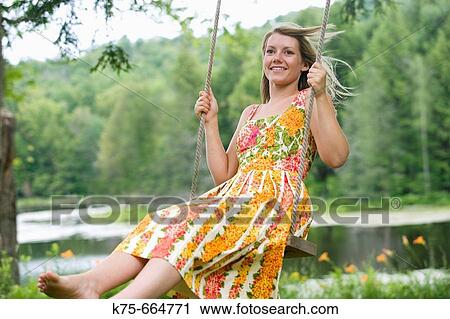 Woman on swing View Large Photo Image Stock Image - Woman on swing. Fotosearch
