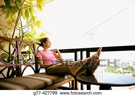 Woman on the balcony. Bangkok. Thailand. View Large Photo Image Stock Photo - Woman on the balcony. Bangkok. Thailand.. Fotosearch