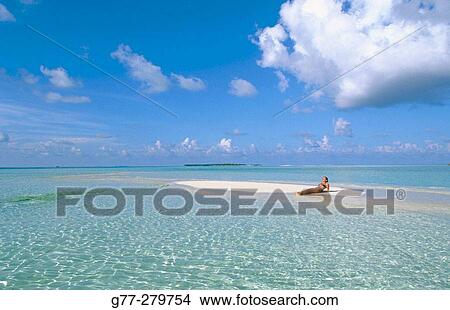 Woman on the beach in White Sands Resort and Spa. Ari Atoll. Maldives View Large Photo Image Picture - Woman on the beach in White Sands Resort and Spa. Ari Atoll. Maldives. Fotosearch