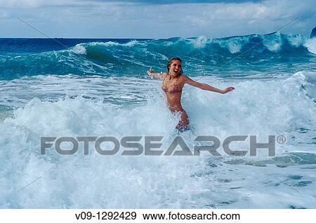 Woman on the beach, Kauai, Hawaai View Large Photo Image Stock Photo - Woman on the beach, Kauai, Hawaai. Fotosearch