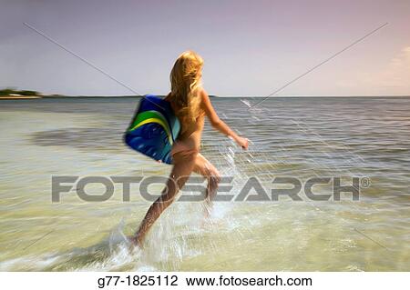 Woman on the beach. Miami Beach, Florida, USA View Large Photo Image Stock Image - Woman on the beach. Miami Beach, Florida, USA. Fotosearch