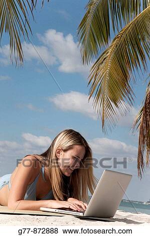 Stock Photo - Woman on the beach, Miami, Florida, USA. Fotosearch