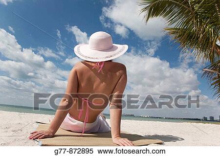 Woman on the beach, Miami, Florida, USA View Large Photo Image Stock Photography - Woman on the beach, Miami, Florida, USA. Fotosearch