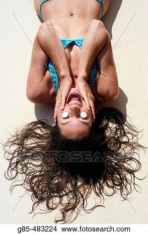 Picture - Woman on the beach. Fotosearch