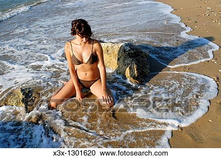 Woman on the beach. Sicily, Italy. View Large Photo Image Stock Image - Woman on the beach. Sicily, Italy.. Fotosearch