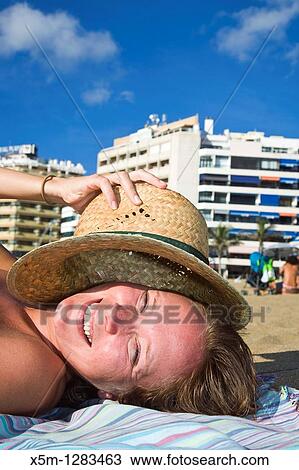 Woman on the beach smiling View Large Photo Image Stock Image - Woman on the beach smiling. Fotosearch