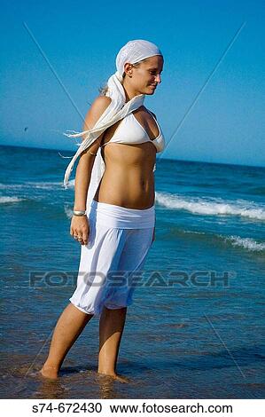 Woman on the beach View Large Photo Image Stock Image - Woman on the beach. Fotosearch