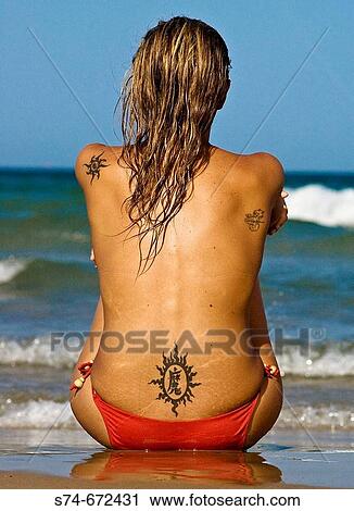 Stock Image - Woman on the beach. Fotosearch