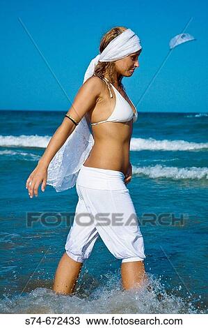 Woman on the beach View Large Photo Image Stock Image - Woman on the beach. Fotosearch