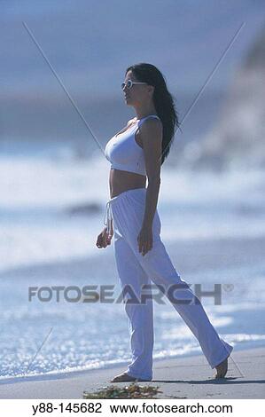 Stock Image - Woman on the beach. Fotosearch