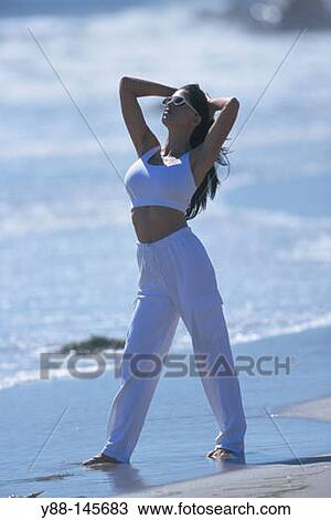 Stock Image - Woman on the beach. Fotosearch