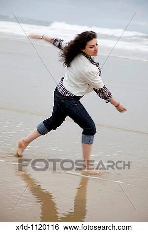 Woman on the beach View Large Photo Image Stock Photograph - Woman on the beach. Fotosearch