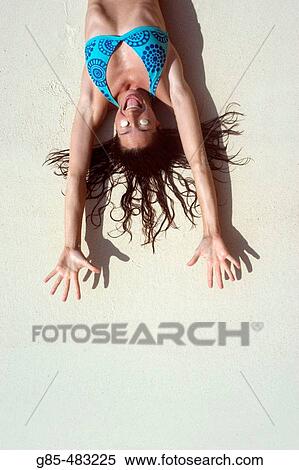 Stock Photography - Woman on the beach. Fotosearch
