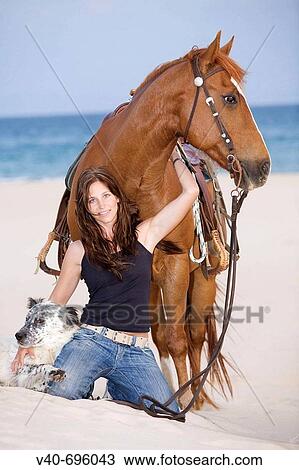 Woman on the beach with horse and dog View Large Photo Image Stock Image - Woman on the beach with horse and dog. Fotosearch