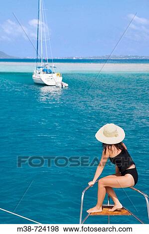 Woman on the front of a sailboat, British Virgin Islands View Large Photo Image Stock Photo - Woman on the front of a sailboat, British Virgin Islands. Fotosearch