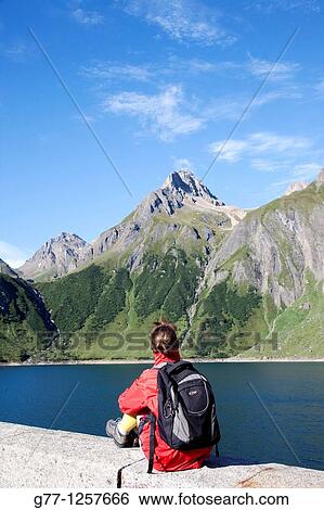 Woman on the mountain, Formazza valley, Piedmont Alps, Italy View Large Photo Image Stock Photograph - Woman on the mountain, Formazza valley, Piedmont Alps, Italy. Fotosearch