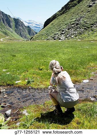 Woman on the mountain. Italy, Piedmont Alps, Formazza Valley. View Large Photo Image Stock Image - Woman on the mountain. Italy, Piedmont Alps, Formazza Valley.. Fotosearch