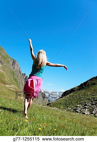 Woman on the mountain. Italy, Piedmont Alps, Formazza Valley. View Large Photo Image Stock Photography - Woman on the mountain. Italy, Piedmont Alps, Formazza Valley.. Fotosearch