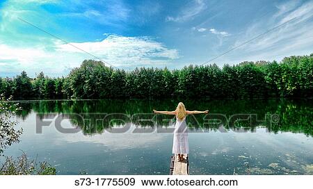 Woman on the pier in Lake Avral, Kirillovka, Samara Region, Russian Federation View Large Photo Image Stock Photo - Woman on the pier in Lake Avral, Kirillovka, Samara Region, Russian Federation. Fotosearch