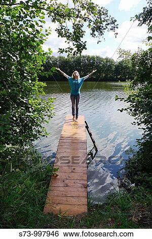 Woman on the pier View Large Photo Image Stock Photograph - Woman on the pier. Fotosearch